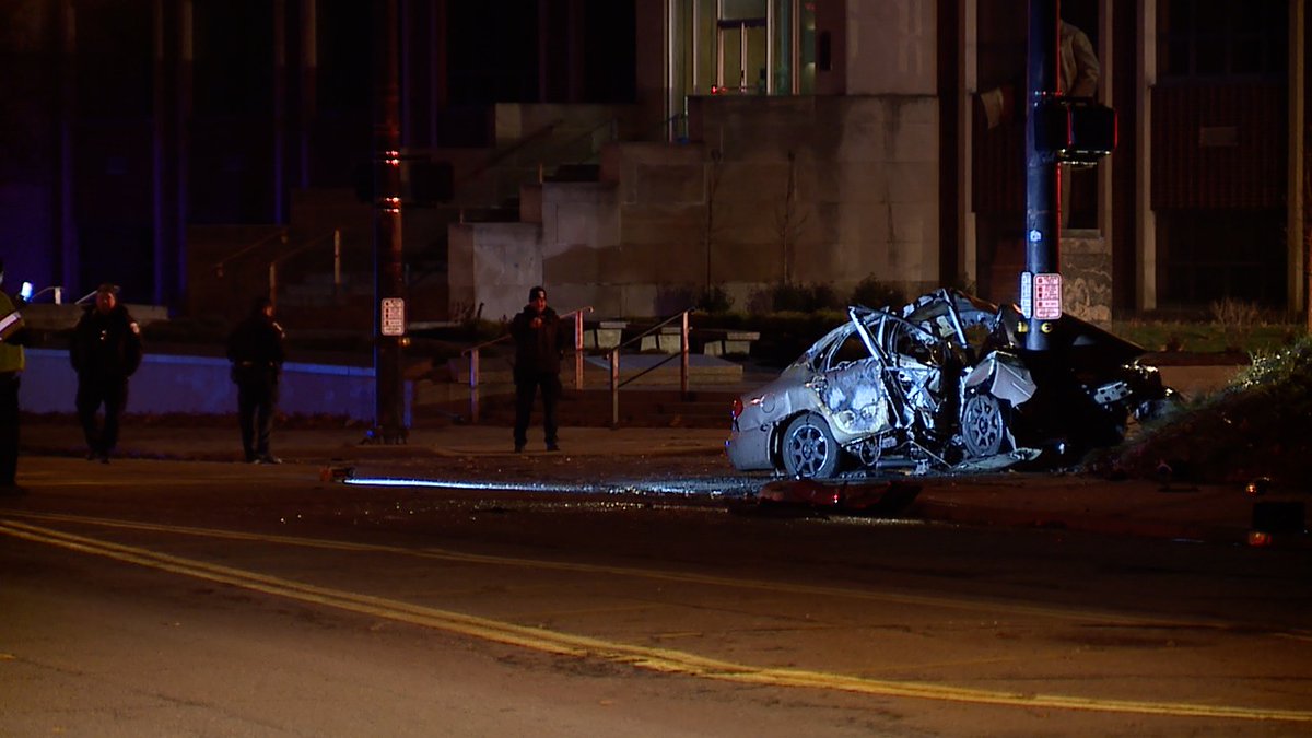 Crash in Akron at Goodyear and Kelly. Summit County Medical Examiner Investigators on scene. Car hit a traffic light pole and caught fire