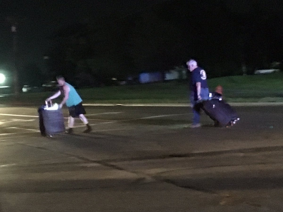 People leaving neighborhoods destroyed, suitcases in tow. 