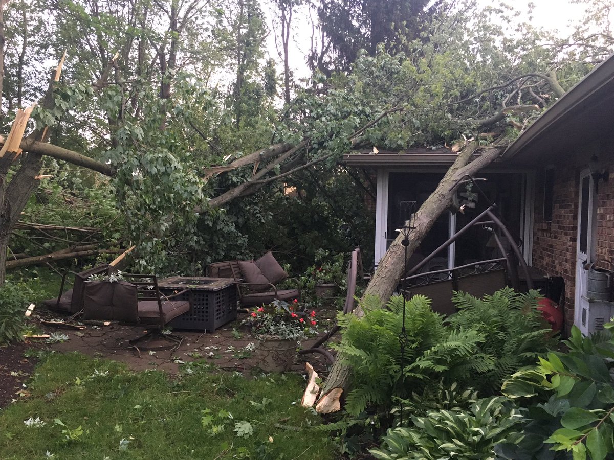 Widespread devastation all across Dayton from multiple tornadoes.  Here's a picture of down trees that crashed roof in Beavercreek 