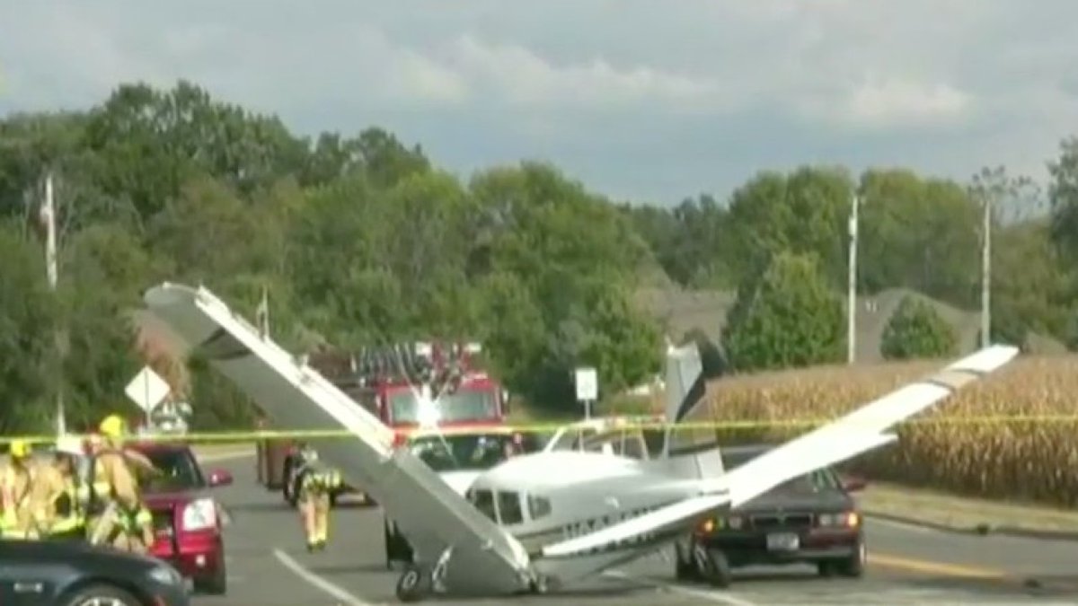 Small plane makes emergency landing on street, rear-ends car, but no injuries reported