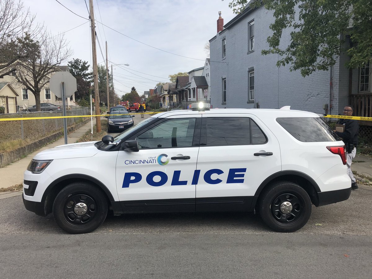 Officers are on scene after a car went into a building on Flatt Terrace. The driver seems to be the victim of a shooting.  A vehicle of interest is a tan or gold sedan.  The driver is thought to be a middle aged male.