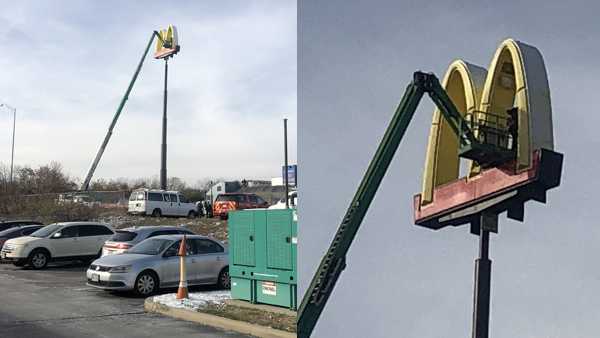 Man trapped more than 100 feet in air rescued from McDonald's sign