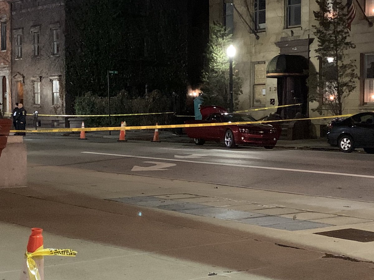 This red Chevy Camero appears to be involved in the shooting in some fashion, at least 2 guns can be seen on the roof of the car 
