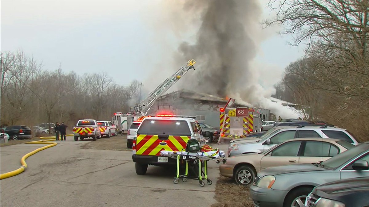 Firefighters are also battling a fire at a business on East Miami River Road in Miami Township