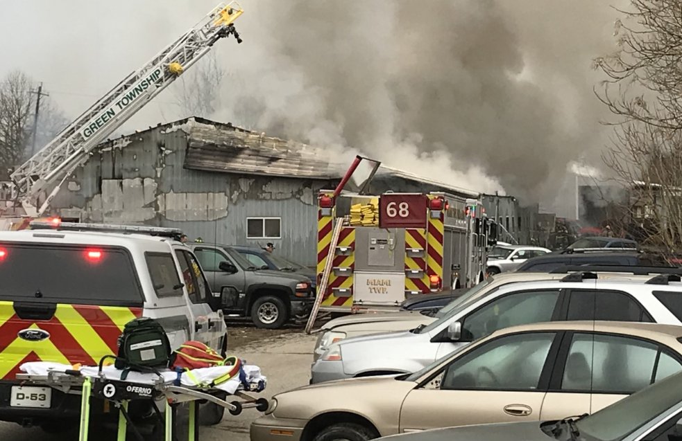 Firefighters battle fire at business on East Miami River Road in Miami Township