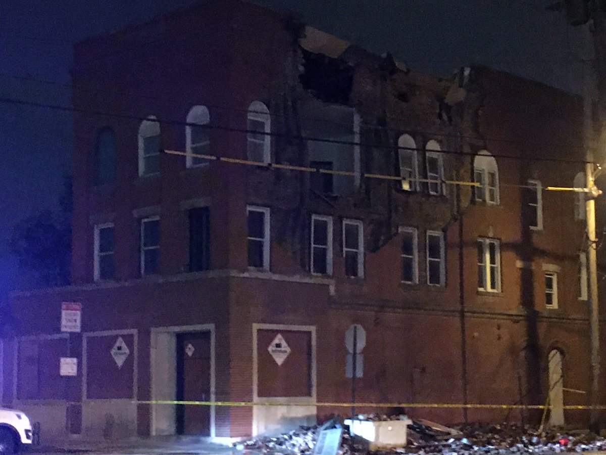 High winds and storms tore part of the side off of this downtown building, leaving a hole in the wall. The building is at the corner of Broad and Grubb St. 