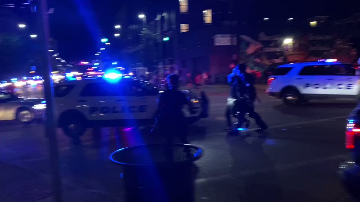 Lights and sirens surrounding Central Pkwy. You can see police making an arrest. This is a protest that's moving all around Cincinnati. @Local12