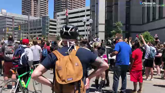 Protesters chant Justice. NOW. near the Columbus Police headquarters