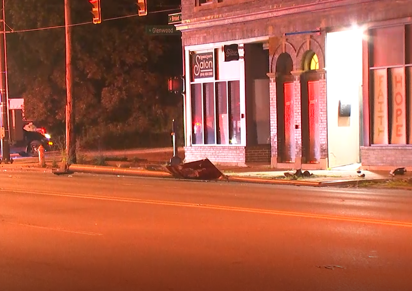 Crews responding to a crash scene along W Broad St near Glenwood  Ave.  Several damaged utility poles along the roadway. 