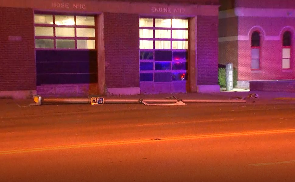 Crews responding to a crash scene along W Broad St near Glenwood  Ave.  Several damaged utility poles along the roadway. 