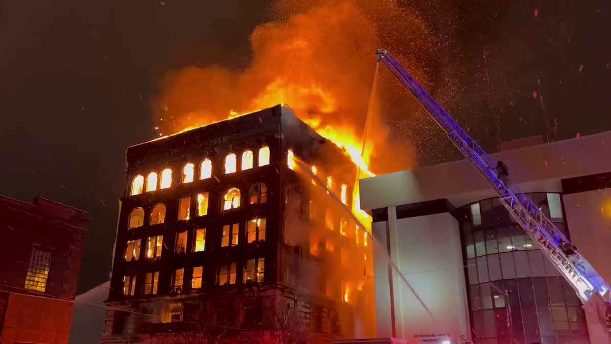 The Masonic Temple in downtown Zanesville is fully engulfed in flames. The iconic building, the city's tallest, is home to numerous art studios. the county jail located next door has been safely evacuated.