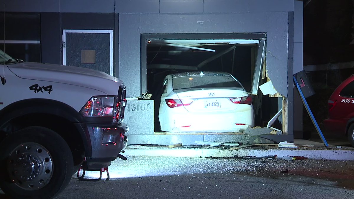 Car into a building at the corner of E131 and Broadway in Garfield Hts. Somehow this driver missed a parked tow truck and parked car and ended up inside the building. One transported