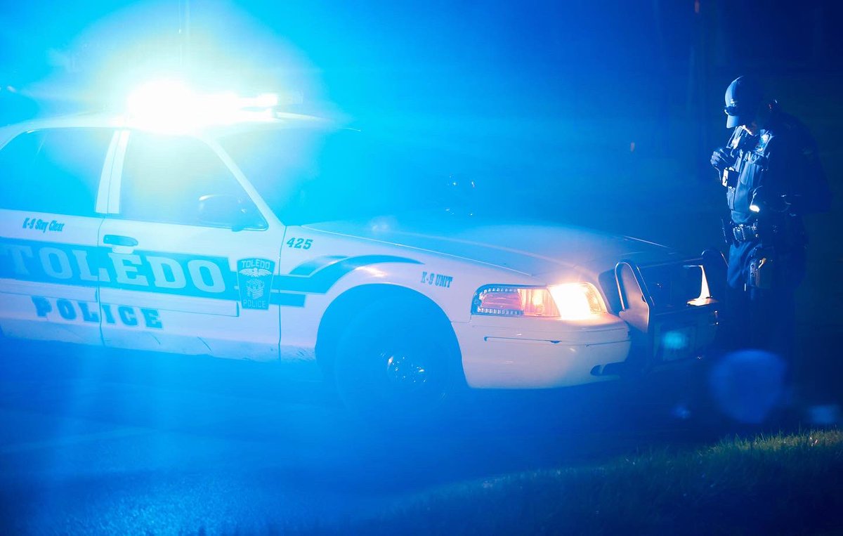 Police officers investigate the scene of a shooting that took the life of a child at Jackman Road and Hillcrest Avenue in Toledo on Wednesday.  