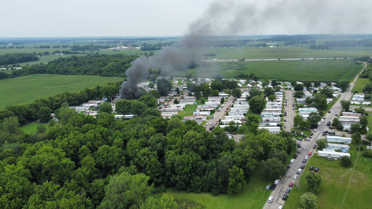 A trailer on scene of reported shooting/swat standoff is on fire.