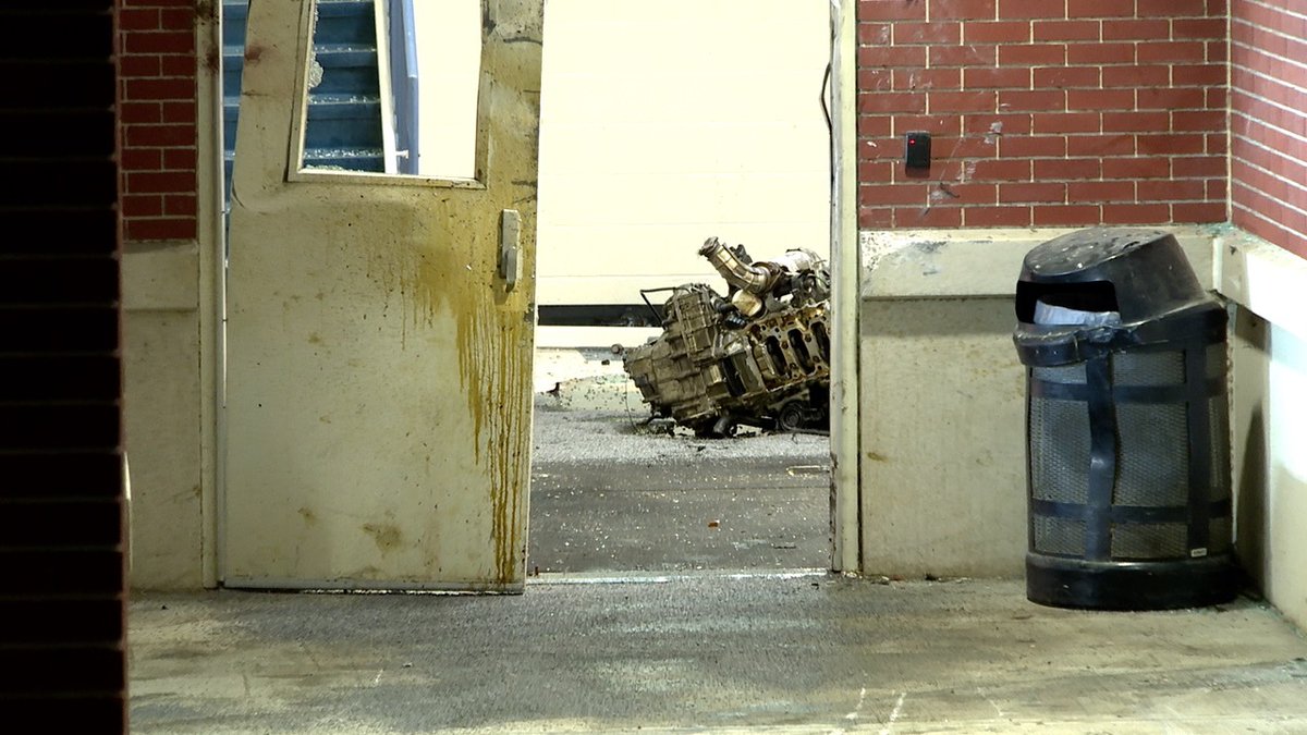 Woodward High School should be open for students this morning despite a crash that sent this Honda's engine into a hallway. One man was taken to the hospital, police are still looking for another person who left the scene 