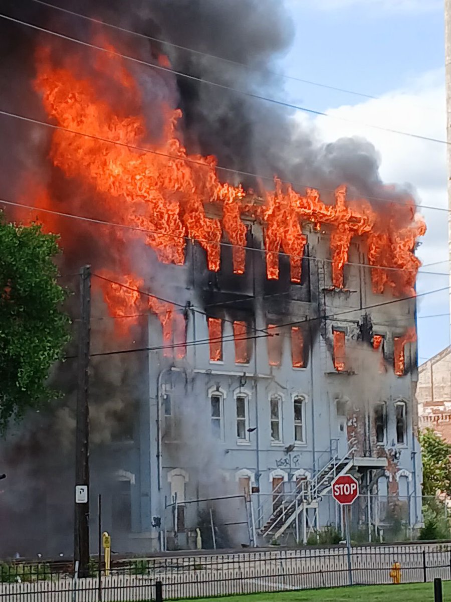 most of the building now almost gone - flames still active