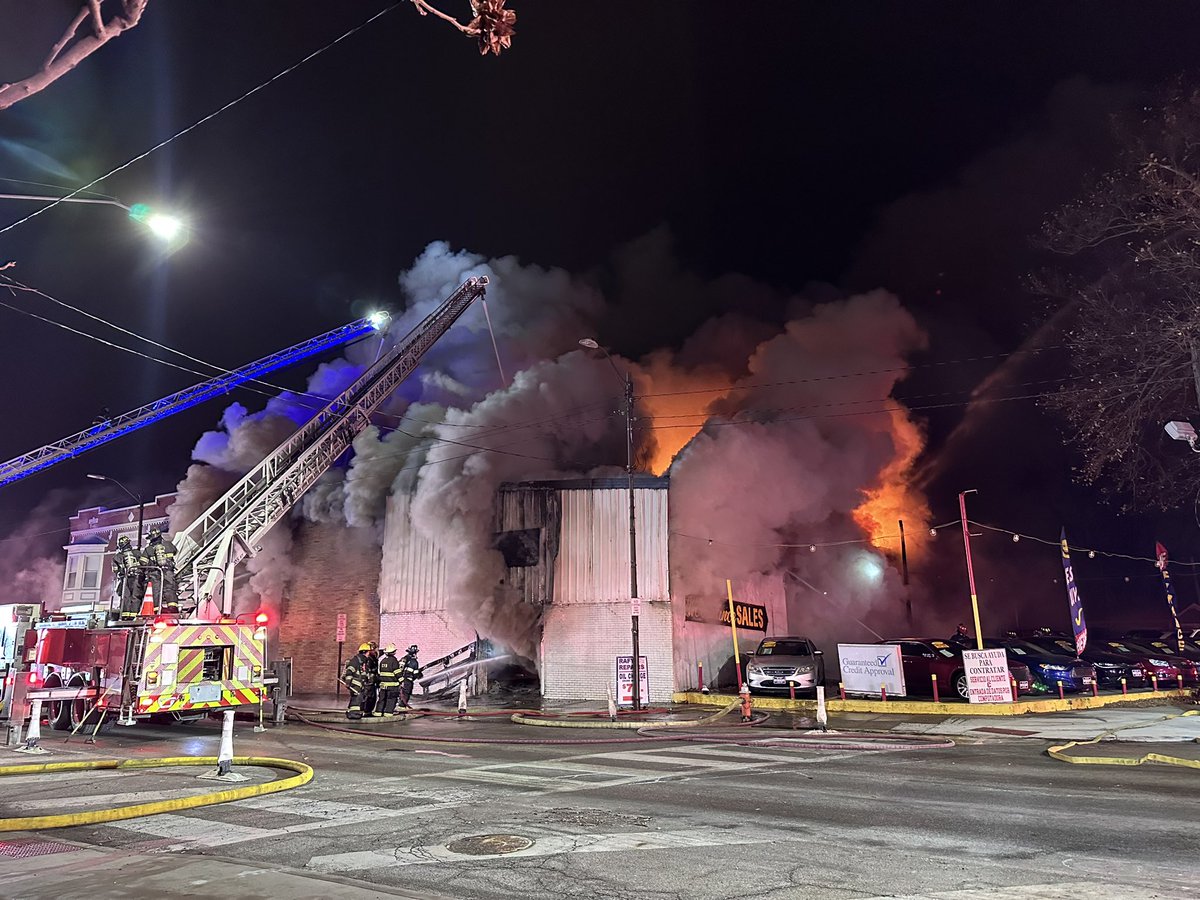 Cleveland fire working a 2-2-2 or 2 alarm fire at West 48th and Lorain. Auto dealership or repair shop. Heavy fire throughout. Three ladders up flowing