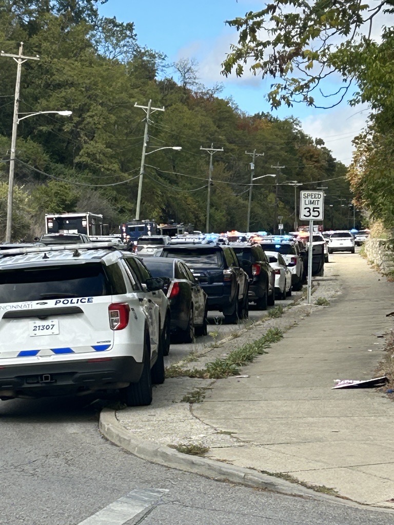 Multiple police agencies, SWAT team responding to a scene in Winton Hills