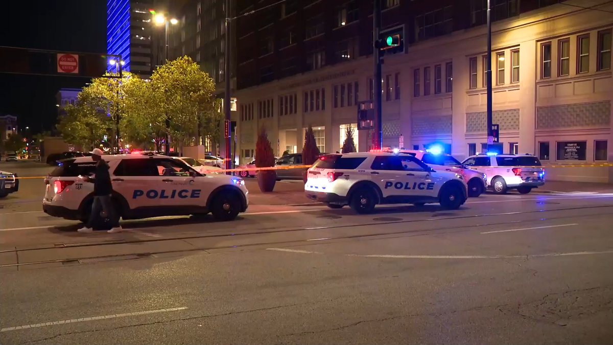 Police are looking for a suspect after a woman was shot in the head in downtown Cincinnati